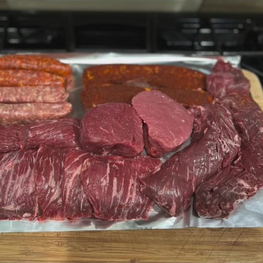Meat Fest of Sausages, Skirt Steak, Filet Mignon, and Slab Bacon